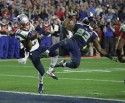 New England strong safety Malcolm Butler (21) intercepts a pass intended for Seattle wide receiver Ricardo Lockette (83) in the final minute of Sunday's Super Bowl to secure the Patriots' 28-24 victory.(AP Photo/Kathy Willens)